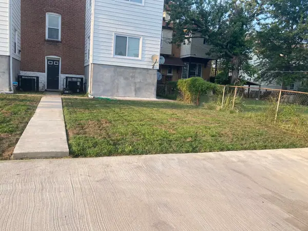 Fresh concrete flatwork at a two-family: a new front walk run out to a new drive.